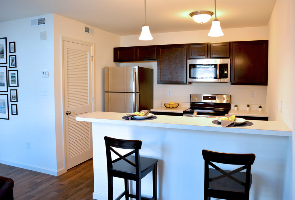 New Construction Kitchen with Stainless Appliances and Breakfast Bar